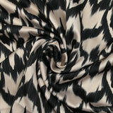 Black ikat printed polyester satin with ecru background