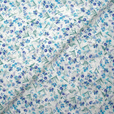Broderie anglaise imprimée petites fleurs bleu fond blanc