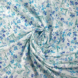 Broderie anglaise imprimée petites fleurs bleu fond blanc