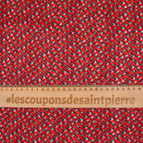Mousseline imprimée bande satin oeil bleu fond rouge