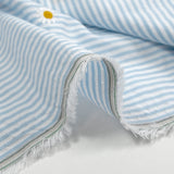 Dyed woven cotton embroidered daisy white and sky blue striped background