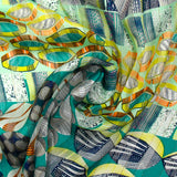 Printed muslin with turquoise and sea green sea pebble satin band