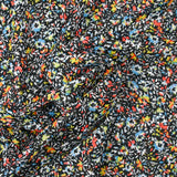Crinkle chiffon printed iridescent crumb of flower black background
