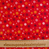 Popeline de coton imprimée neige fond rouge