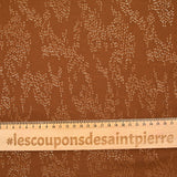 Gold leaf printed muslin with camel background