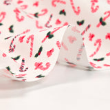 Popeline de coton imprimée sucre d'orge framboise fond blanc