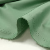 Popeline de coton satinée vert amande
