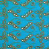 Broderie anglaise festonnée beige Éléonore fond bleu azur