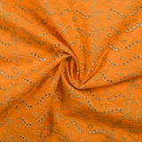Broderie anglaise festonnée beige Éléonore fond orange