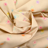 Coton imprimé petites fleurs colorées fond beige