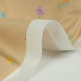 Coton imprimé petites fleurs colorées fond beige