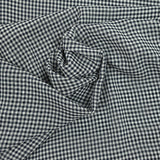 Polyester muslin with small navy and white tiles