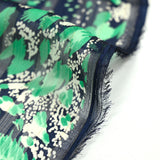 Mousseline de polyester imprimée bande satin marine et vert