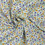 Viscose imprimée jardin secret violet et moutarde fond blanc