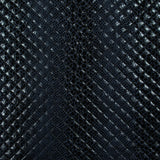 Matelassé imprimé reptile fond bleu marine