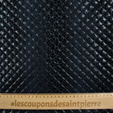 Matelassé imprimé reptile fond bleu marine