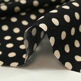 Viscose imprimée à pois 8mm écru fond noir