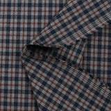 Woven-dyed polycotton with navy and dark burgundy checks on a mottled gray background