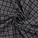 Woven-dyed polycotton with navy and dark burgundy checks on a mottled gray background