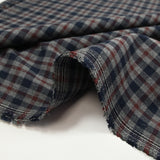 Woven-dyed polycotton with navy and dark burgundy checks on a mottled gray background