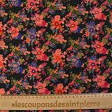 Maille de viscose satinée imprimée champs de fleurs corail fond noir