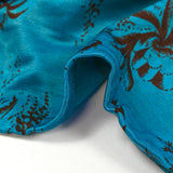 Maille de viscose satinée imprimée Versailles fond bleu turquoise