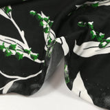 Maille de viscose satinée imprimée brin de muguet fond noir