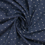 Cotton jersey printed trio of polka dots on navy background