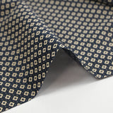 Cotton jersey printed with dotted diamonds, navy background