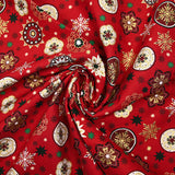 Popeline de coton imprimée médaillons et flocons de Noël fond rouge