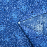 Popeline de coton imprimée jardin fleuri fond bleu cobalt