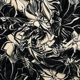 Short velvet jersey printed with ivory flowers and black background
