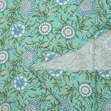Popeline de coton imprimé digital floral bohème bleu fond vert d'eau