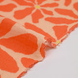Double gaze imprimée flower power fond mandarine