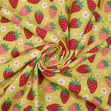 Cotton poplin printed with wild strawberries on anise background