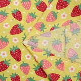 Cotton poplin printed with wild strawberries on anise background