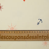 Gabardine 100% coton symbole et soleil fond blanc cassé