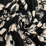 Jersey de velours ras imprimé feuille graphique noire fond ivoire