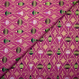 Cotton poplin printed with gold diamonds, moons and stars on a purple background