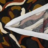 Brown and ecru wave printed knitted knit with black background