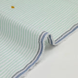 Coton tissé teint brodé marguerite fond rayé blanc et vert