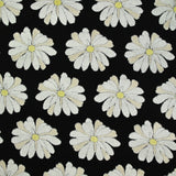 Jersey de coton imprimé marguerite éponge en relief fond noir