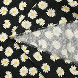 Jacquard de coton natté marguerite fond noir