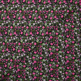 Digital printed cotton voile meadow of small fuchsia and apple green flowers on a black background