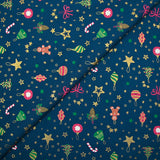 Cotton poplin printed gingerbread men and glittered stars blue background