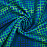 Gabardine de polyester imprimée petit pois bleu fond vert