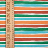 Cotton poplin printed with orange, green and turquoise deckchair stripes