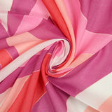 Voile de polycoton vague violette, rose et rouge fond blanc