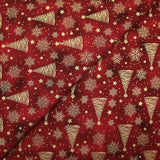 Popeline de coton imprimée sapins dorés fond marbré rouge