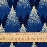 Cotton poplin printed with sparkling fir trees on a midnight blue background